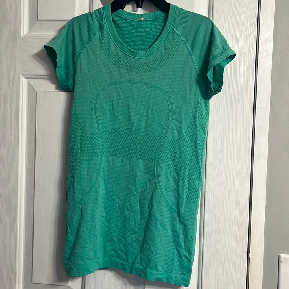 Teal blue/green lulu swiftly.